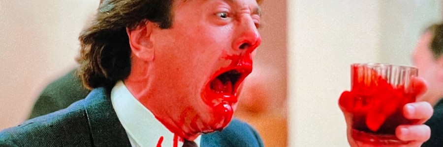 Man bleeding from his face screaming.