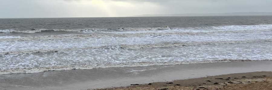 Grey waves on a sombre beach